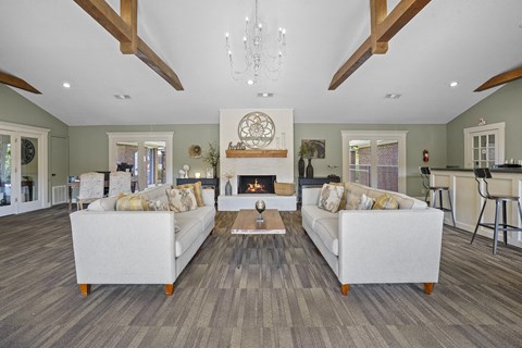 a living room with couches and a fireplace